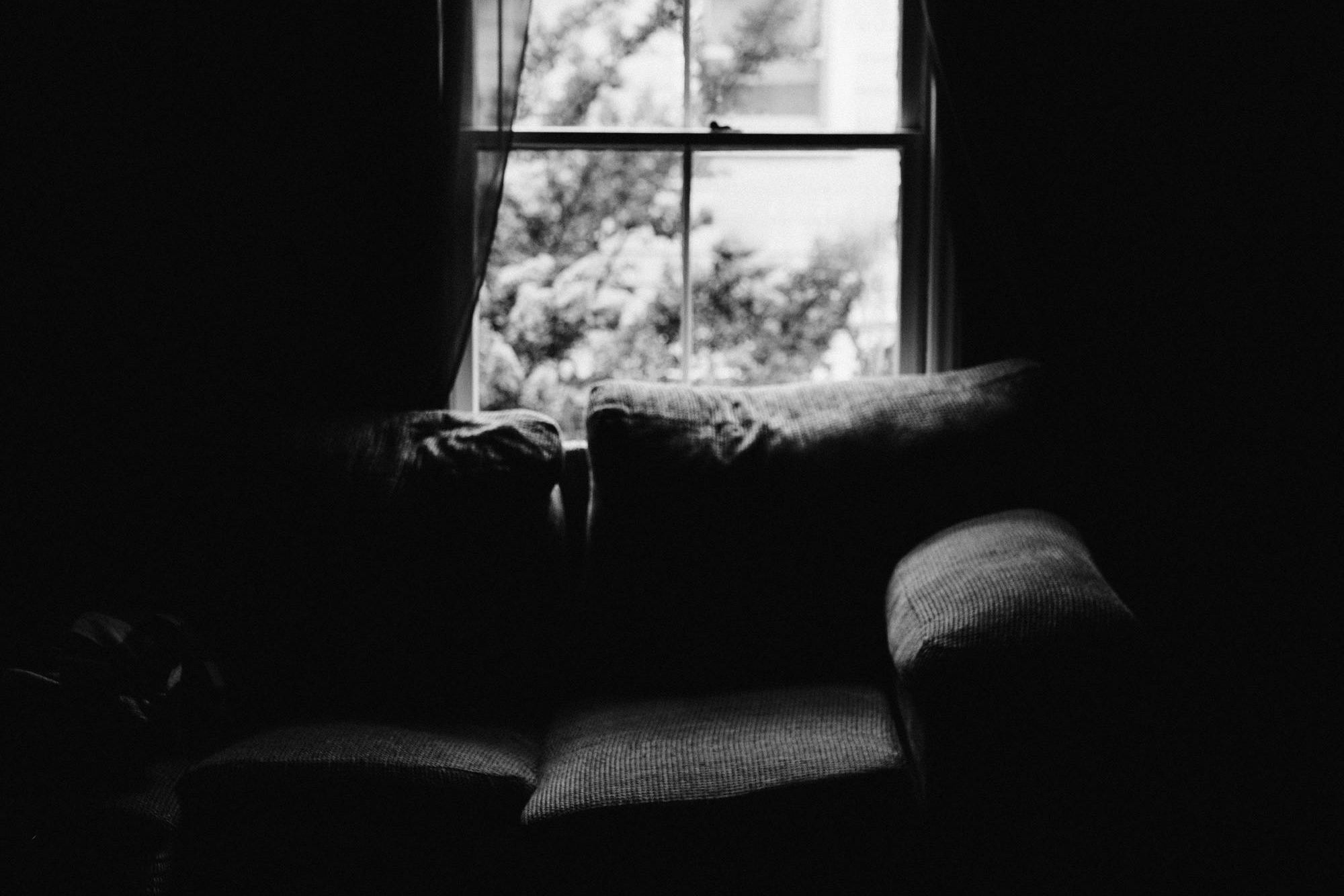 Book open on the coffee table in a moody cottage